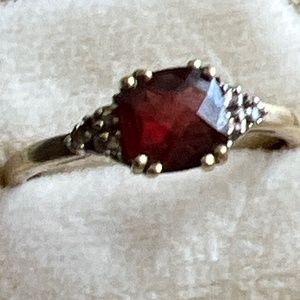 14k garnet ring with six diamonds